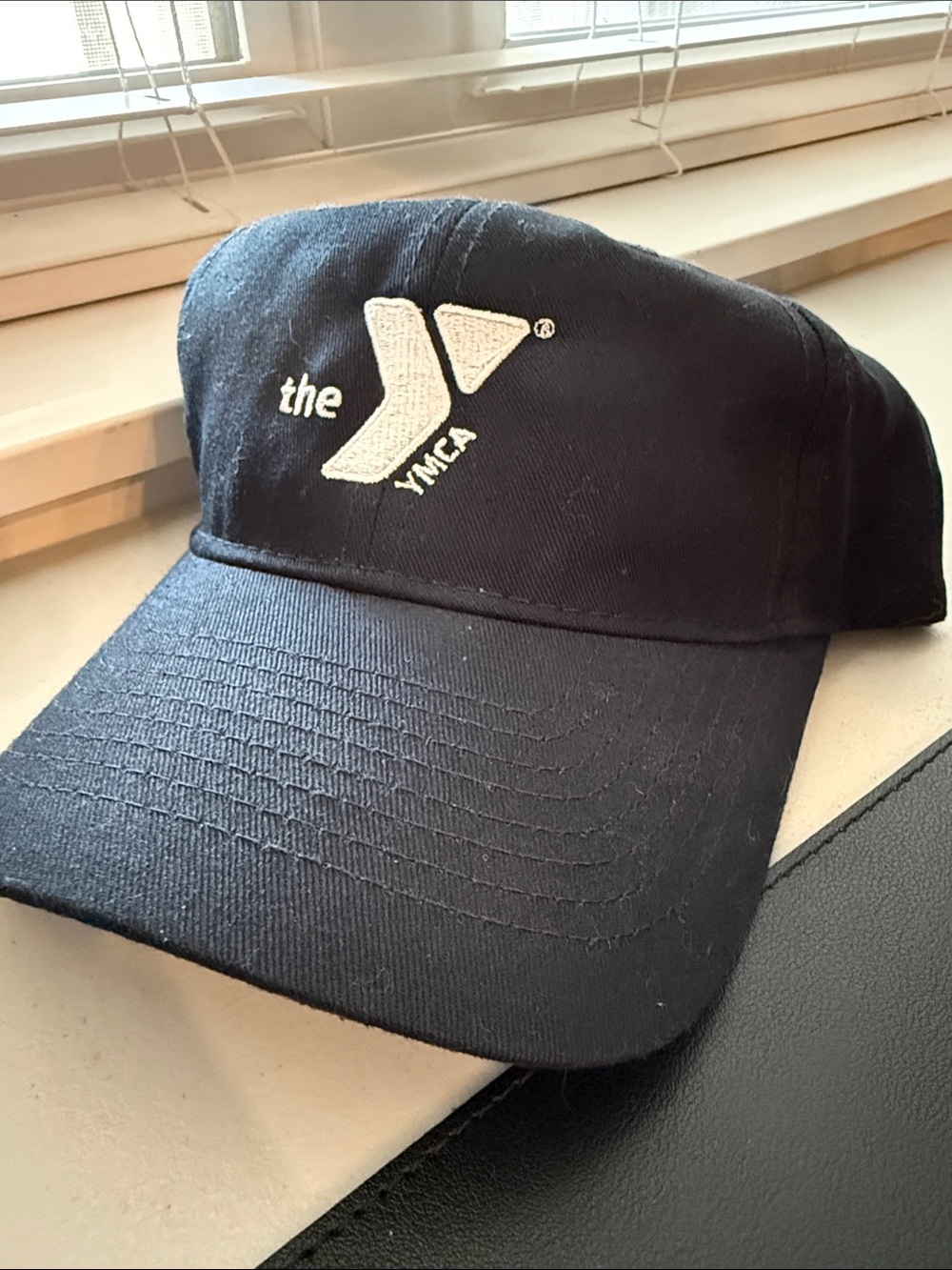 YMCA Black Baseball Cap with Silver YMCA Emblem